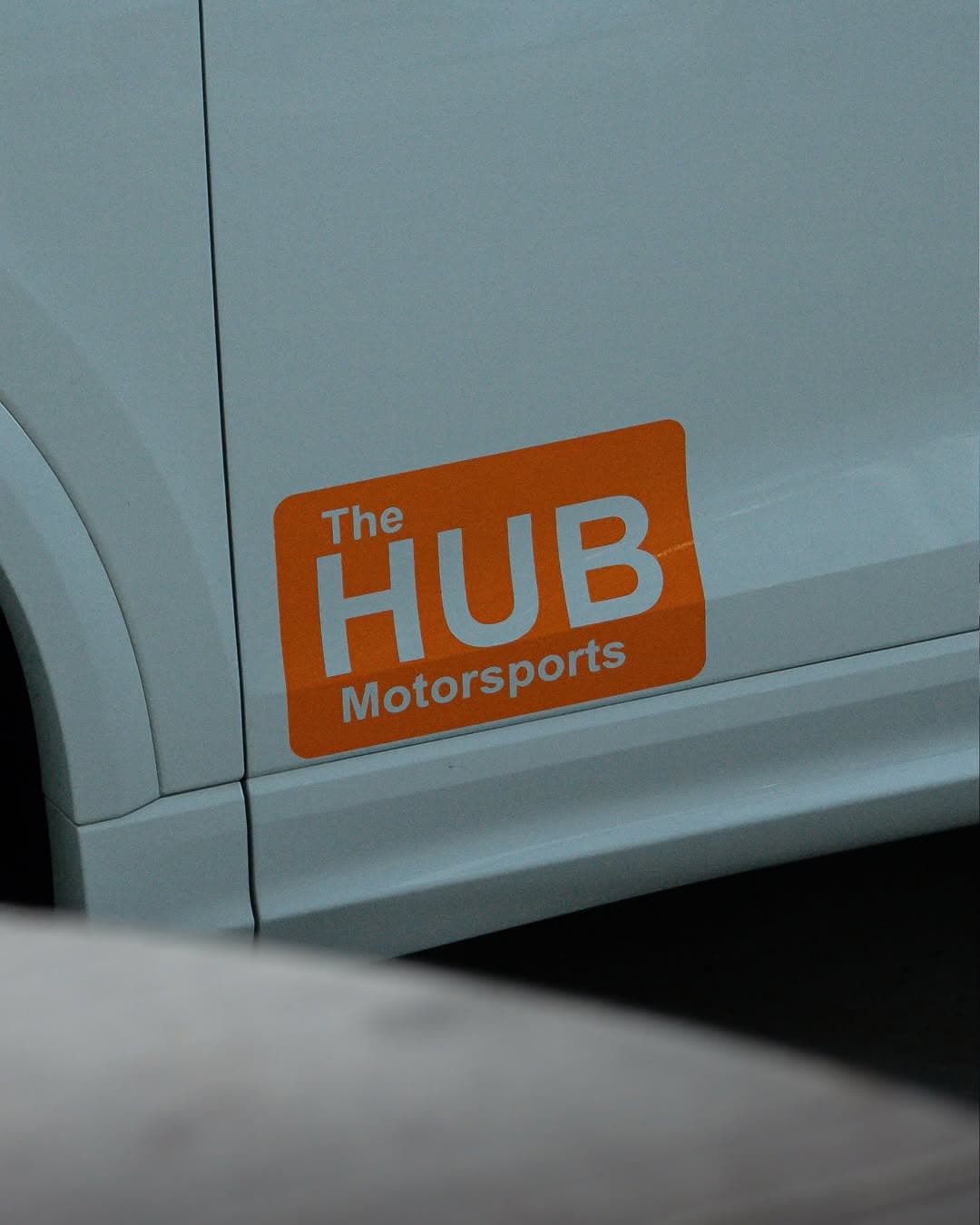 The HUB Motorsports branding decal on a custom build