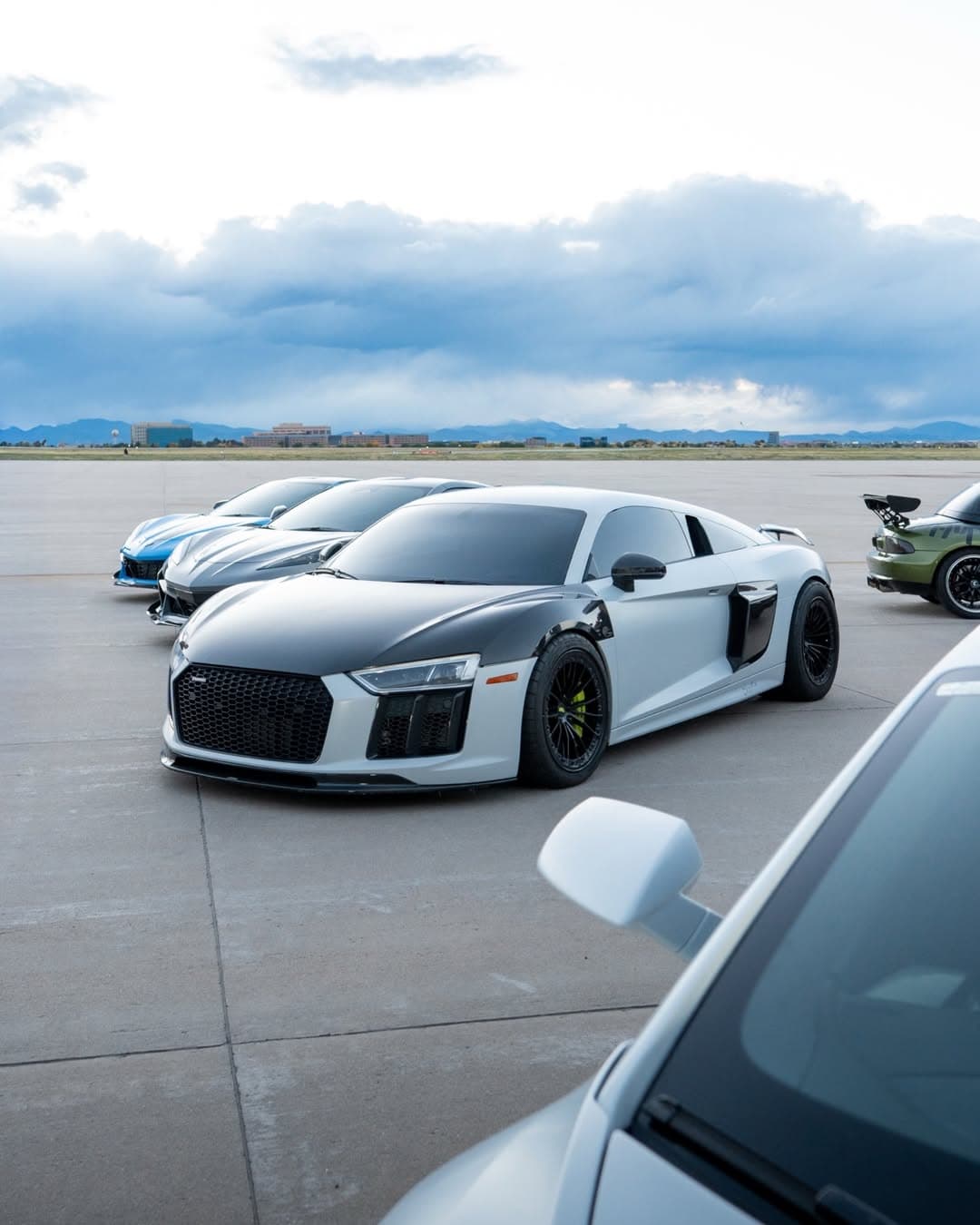 The HUB Motorsports fleet — Audi R8 and performance cars on Colorado tarmac